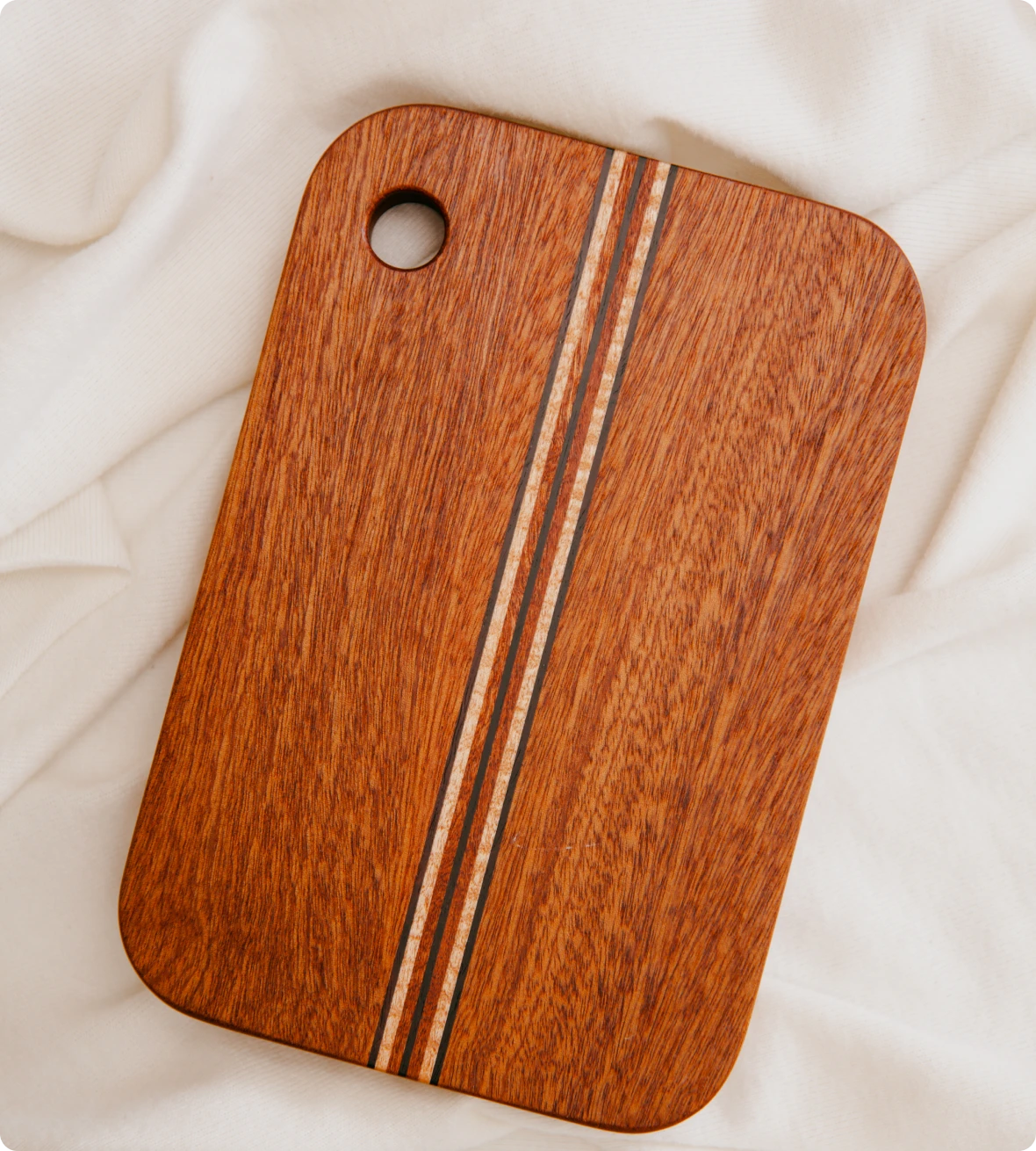Rectangular wood board on fabric